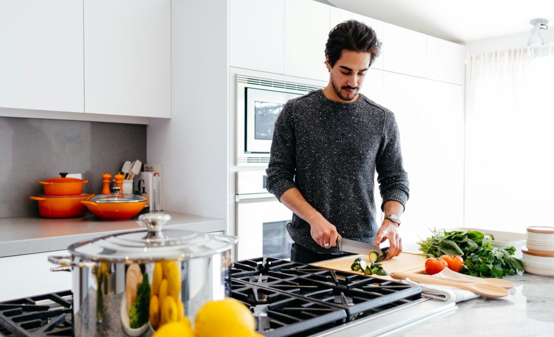 man cutting vegetables