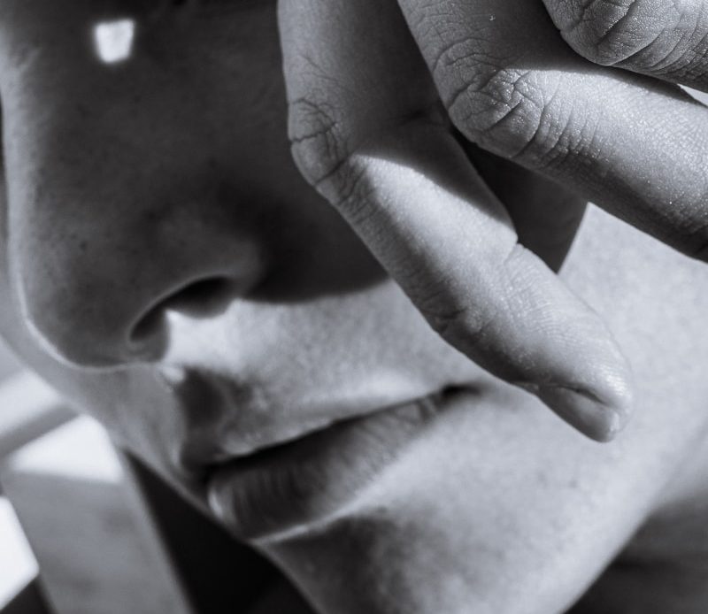 grayscale photo of mans face
