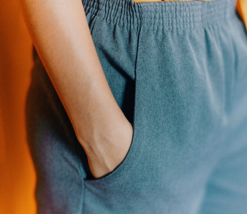 closeup photo of person hiding his right hand in his pocket