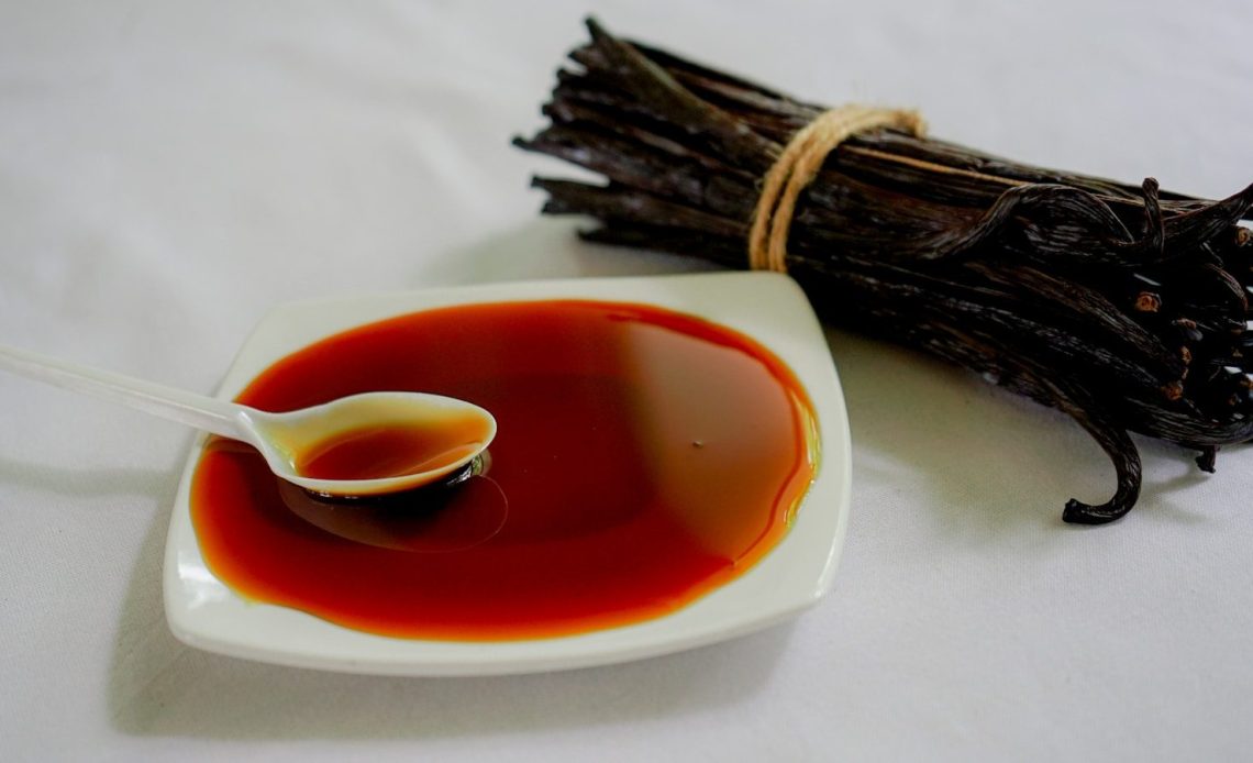 a spoon is sitting in a bowl of red liquid