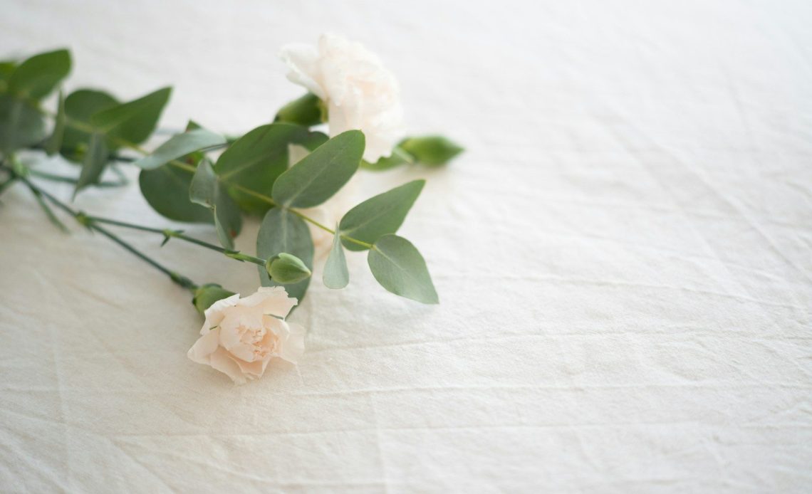 white flower on white textile